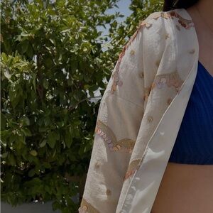 Handmade Persian-style coat with gold and pink sequins in a wavy pattern